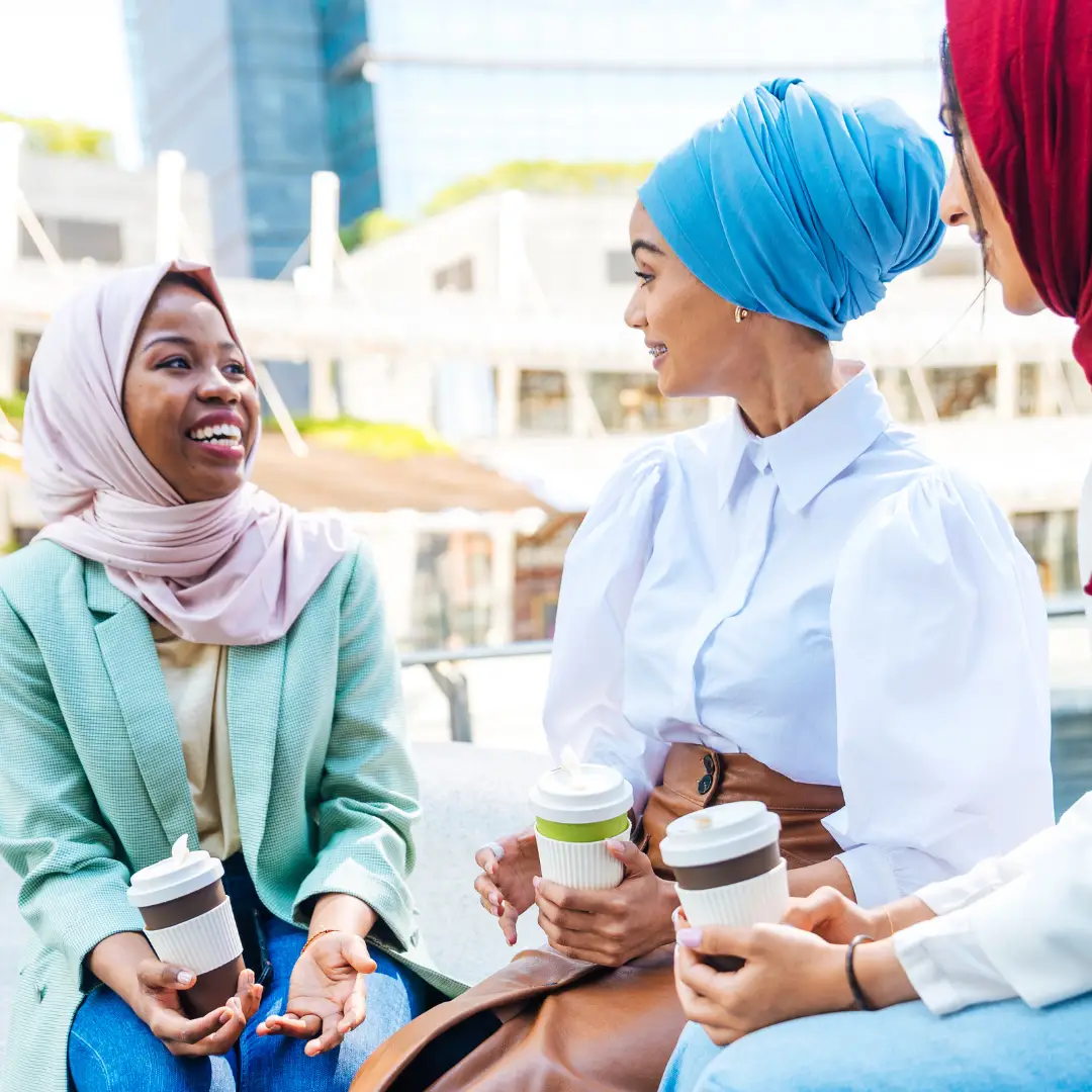 Group of muslim women having coffee together