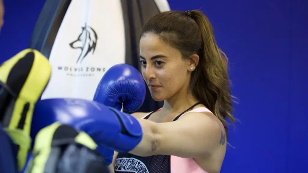 Wolves Zone MMA Academy woman boxing in a mixed martial arts class